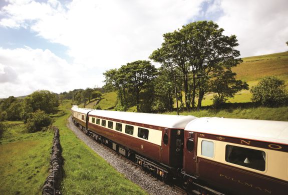 northern belle train travelling through countryside