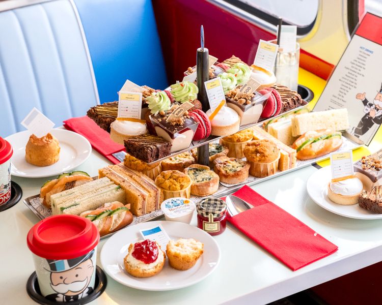 the afternoon tea spread on a monopoly afternoon tea tour bus