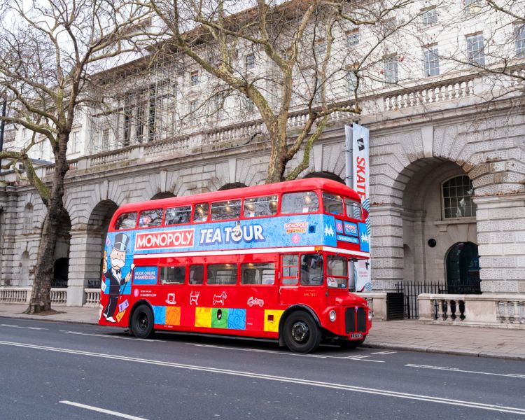 the monopoly afternoon tea tour bus parked up in london