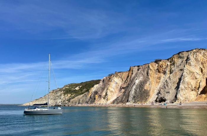 a yacht anchored off the coast of the isle of wight