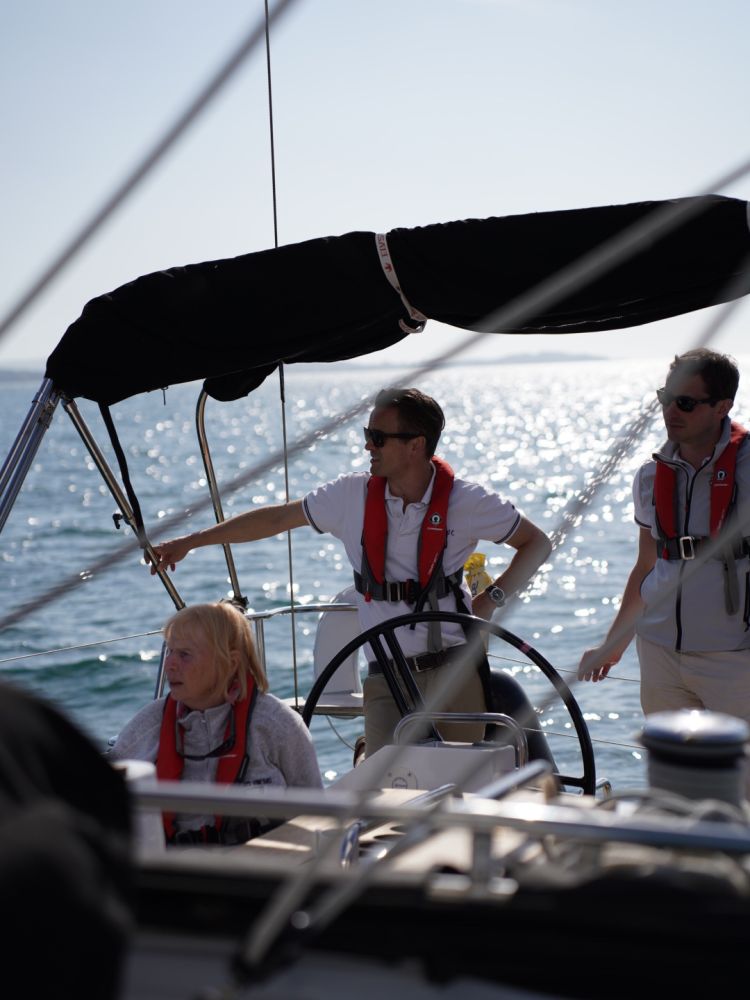 people on a yacht sailing the solent