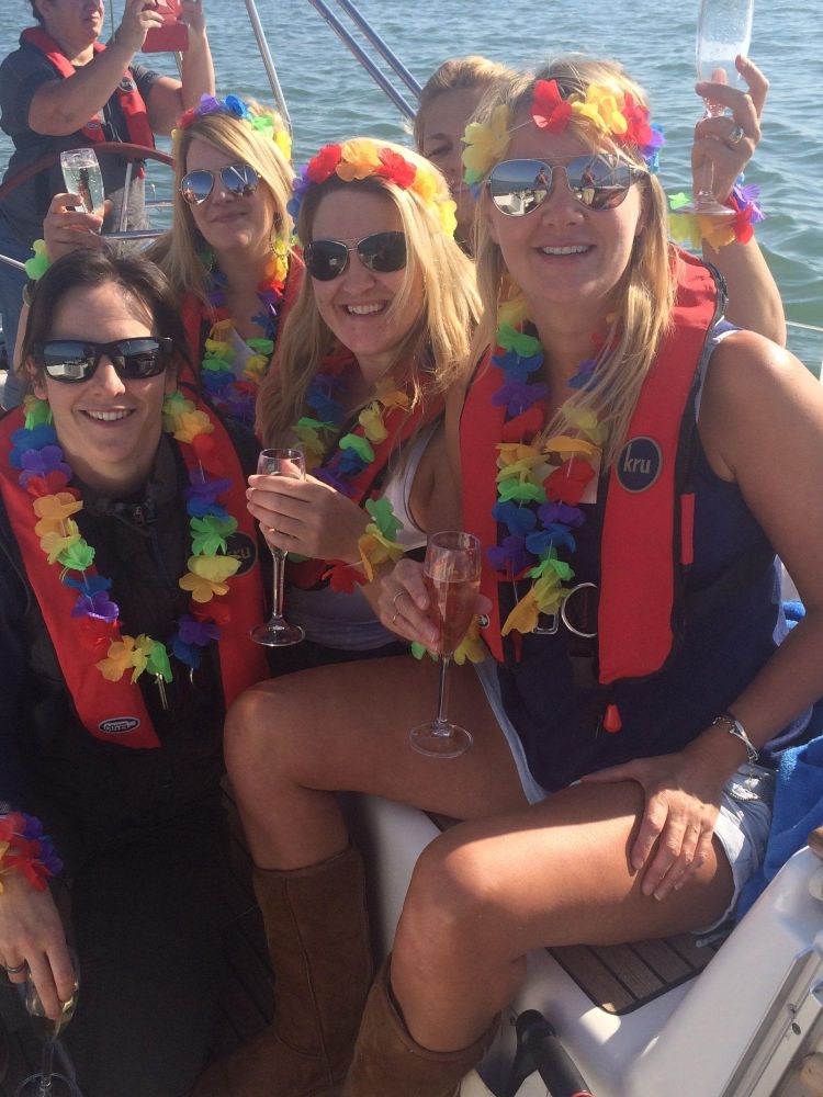 group of ladies having photo taken on yacht experience on the solent