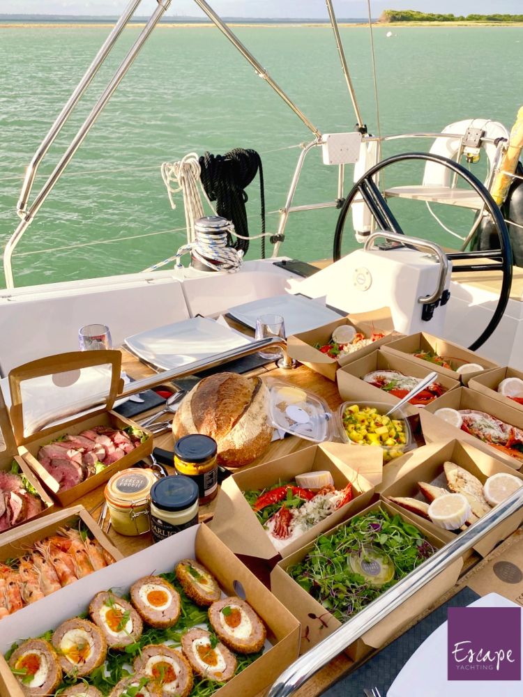 a lobster picnic lunch served on board a yacht sailing on the solent