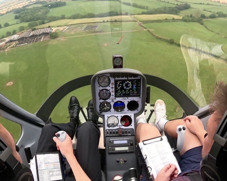 view out the cockpit on a helicopter flying lesson