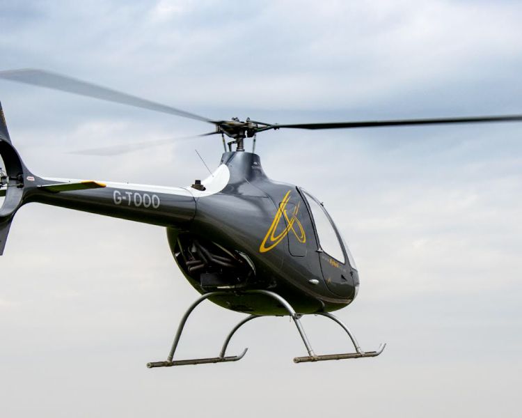 a cabri g2 helicopter in the air