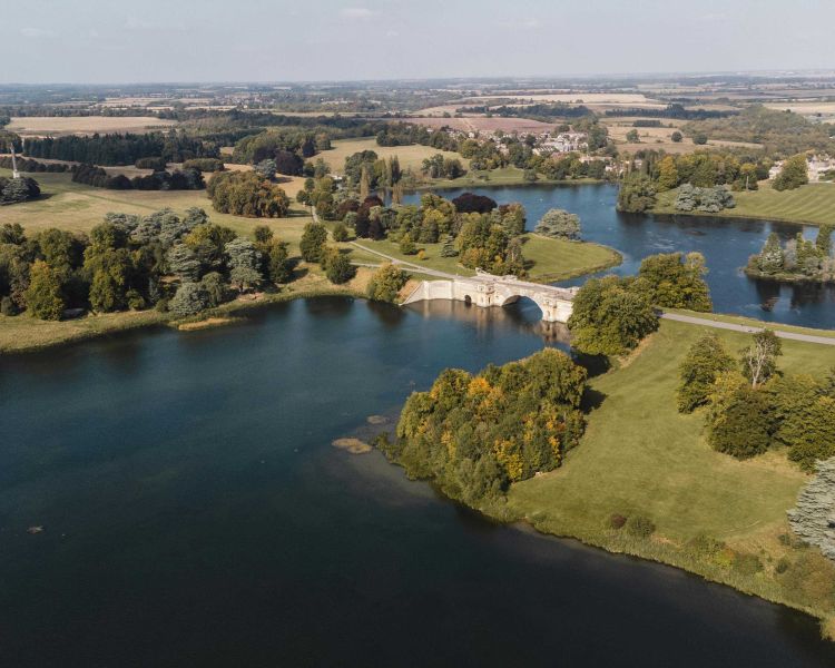 the grounds and lake of blenheim palace seen on a helicopter ride