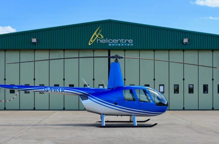 helicopter on airfield ready for a 15 mile thrill seeker helicopter ride