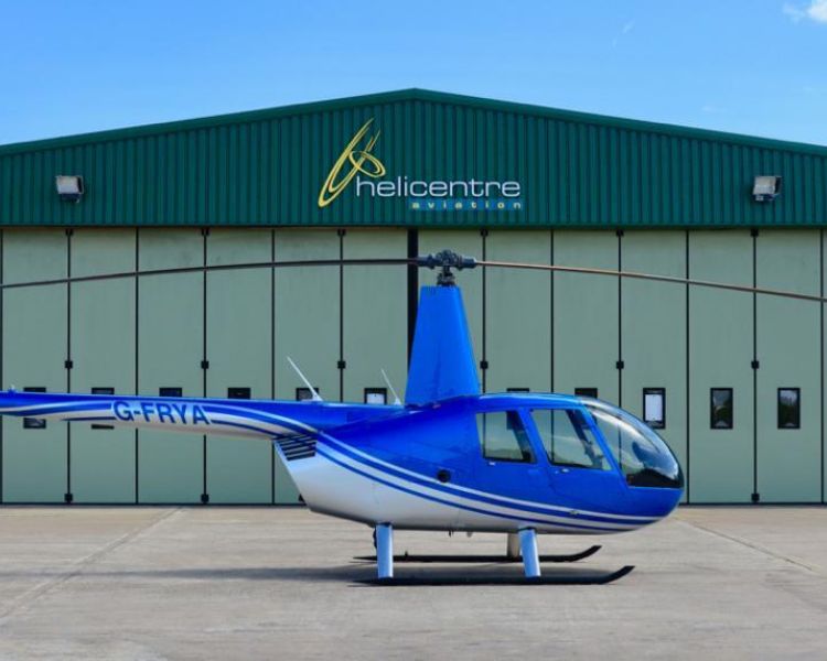helicopter on airfield ready for a 15 mile thrill seeker helicopter ride