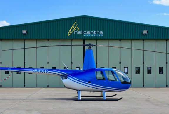 helicopter on airfield ready for a 15 mile thrill seeker helicopter ride