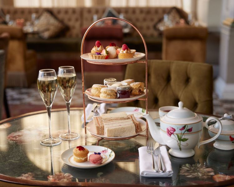 a champagne afternoon tea laid out at the clermont charing cross hotel