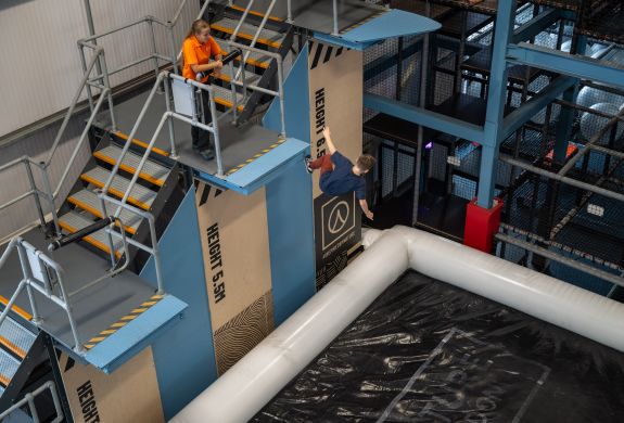 person jumping on adrenaline drop at activity centre in wales