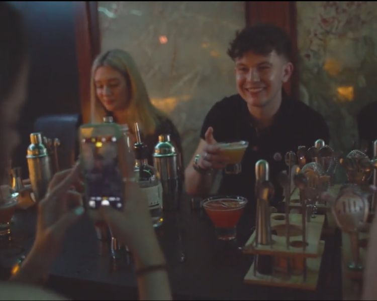 people at a cocktail masterclass at inamo london mixing cocktails