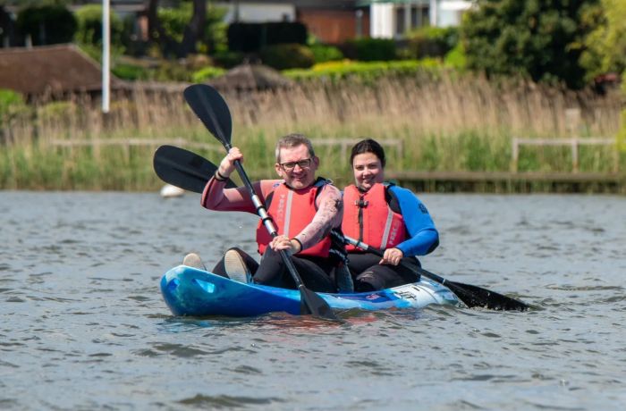 Couple in kayak on water at oulton broad water sports centre