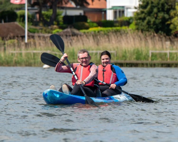 Couple in kayak on water at oulton broad water sports centre