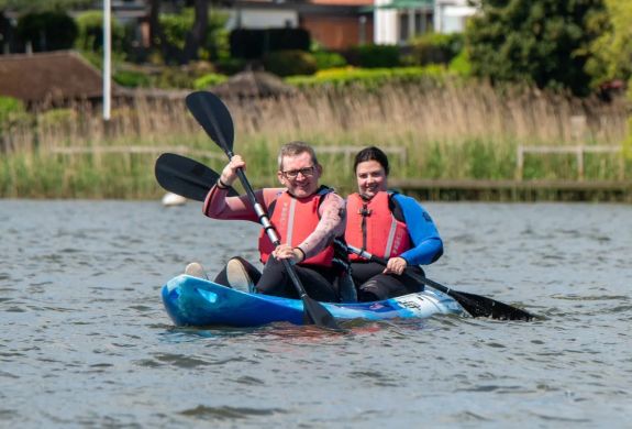 Couple in kayak on water at oulton broad water sports centre