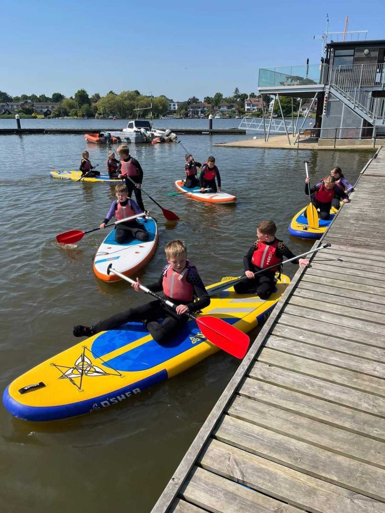 Children paddleboarding at oulton broad water sport centre