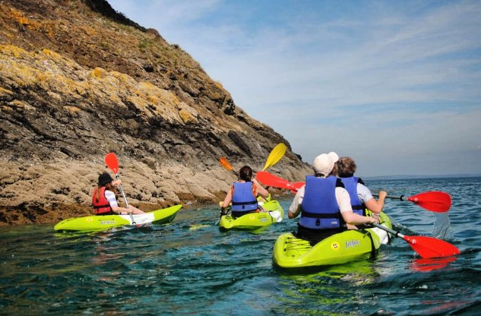 People kayaking along pembroskeshire coast