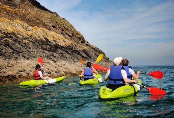People kayaking along pembroskeshire coast