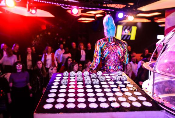 Bingo balls on stage showing crowds