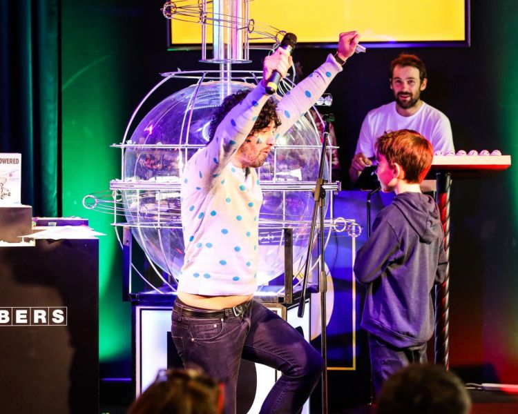 Man and child on stage at family bingo in london