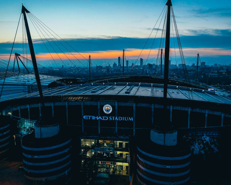 Man city etihad stadium at dusk high view