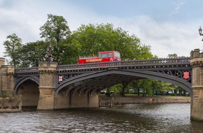 York bridge over river sightseeing open top bus