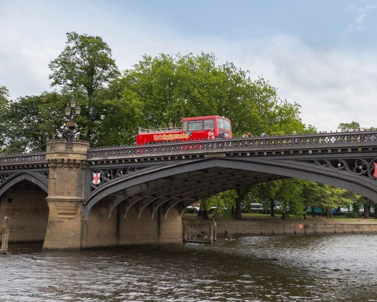 York bridge over river sightseeing open top bus