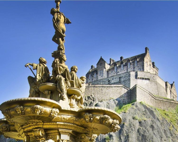 Fountain in the park near edinburgh castle rock