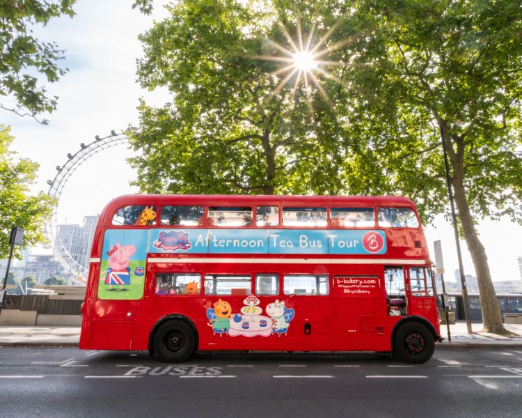 Peppa pig bus on london road in sunshine