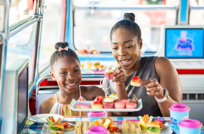 Mum and daughter on peppa pig afternoon tea bus tour