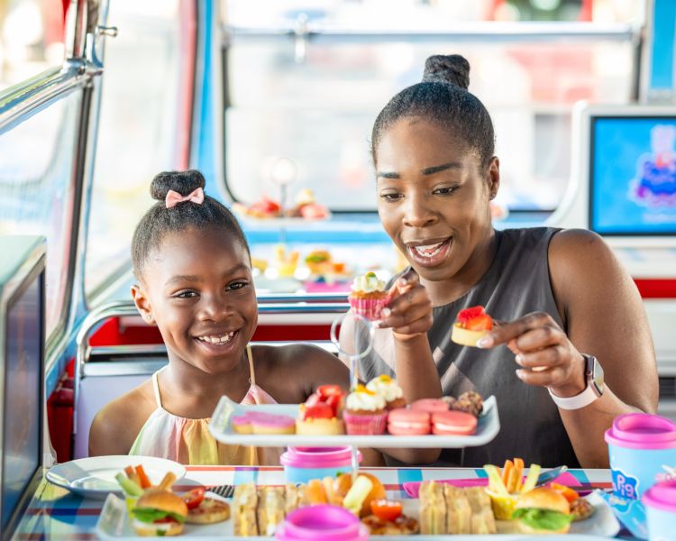 Mum and daughter on peppa pig afternoon tea bus tour