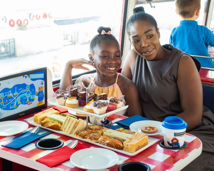 Mum and daughter on paddington afternoon tea bus tour