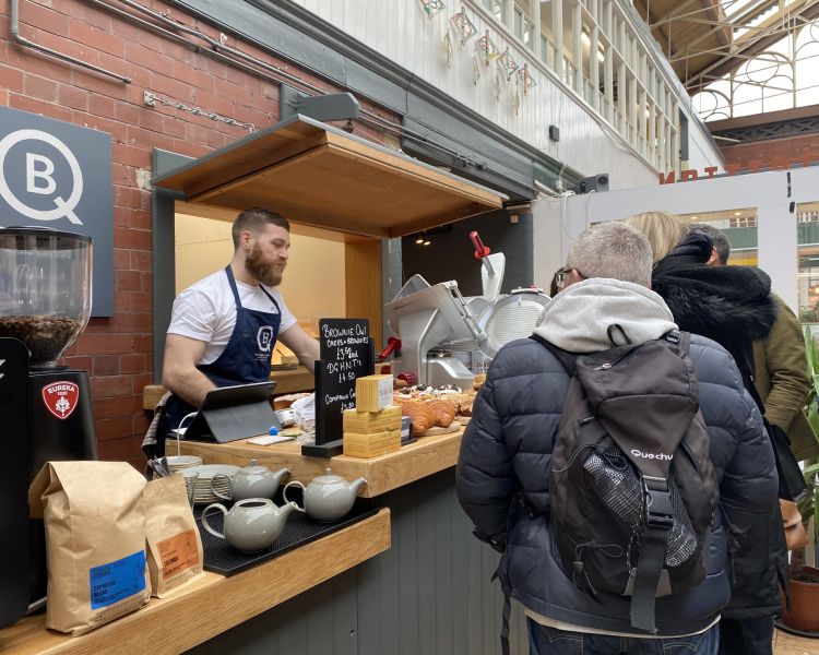 Group visiting cafe on manchester food tour