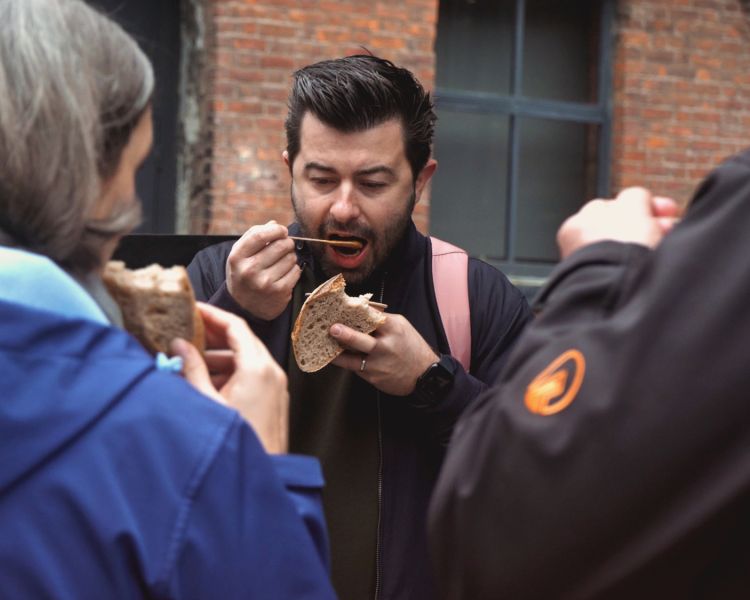 People eating soup on manchester food tour