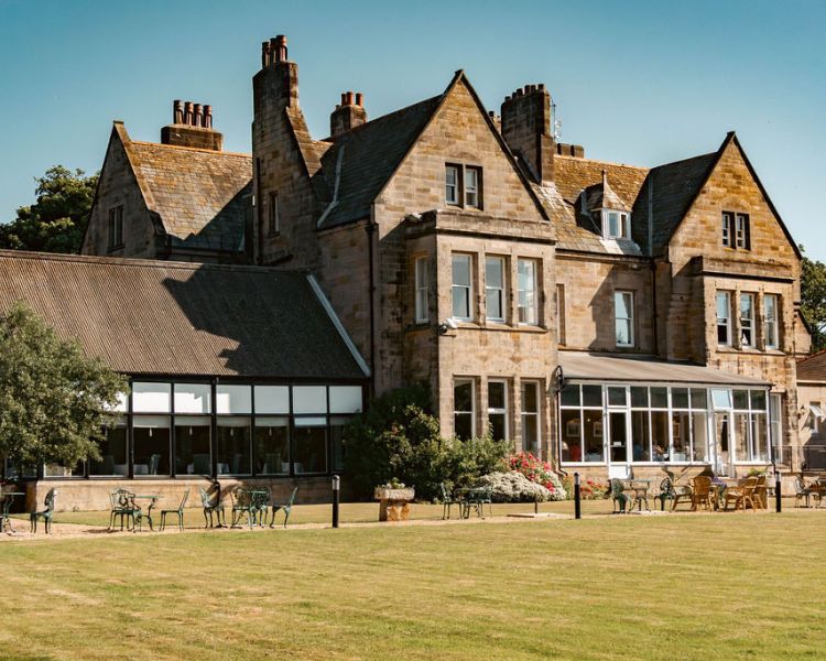 View of back of grinkle park hotel with lawns