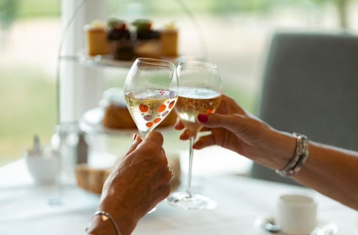 Ladies with champagne at grinkle park afternoon tea