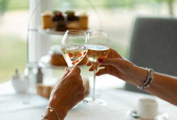 Ladies with champagne at grinkle park afternoon tea