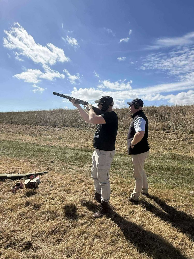 Man learning how to clay shoot with instructor in essex
