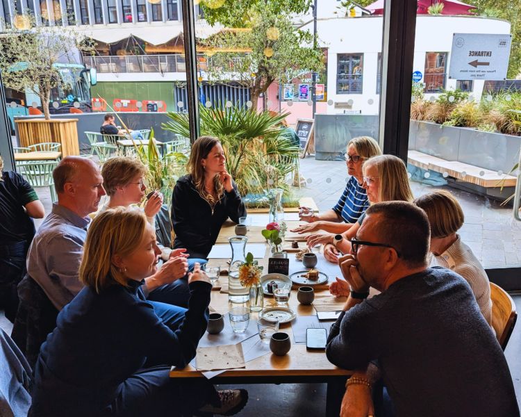 Group sitting at table in loaf bakery in bristol