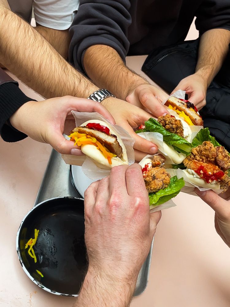 Group eating street food on a food mystery tour in london