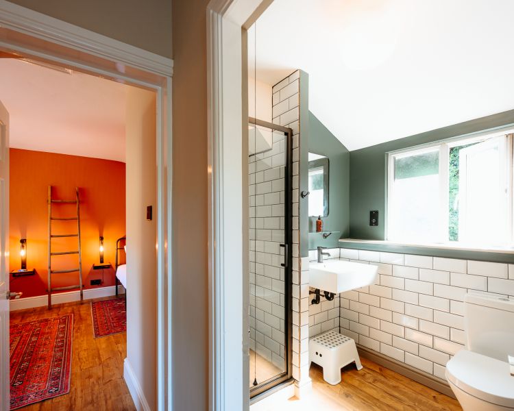 View into bathroom at zip world cottage