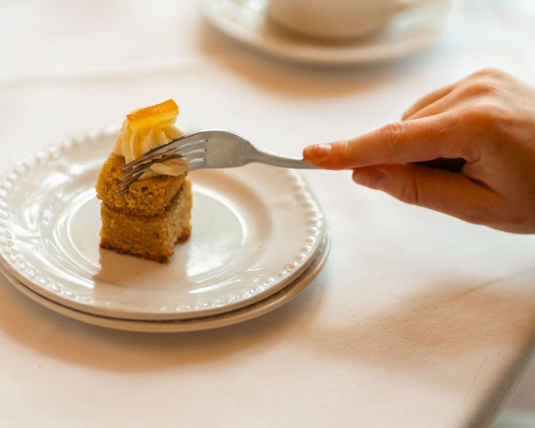 Cutting cake at afternoon tea at farington lodge