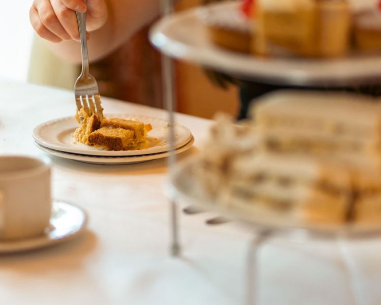 Eating cake at afternoon tea at farington lodge