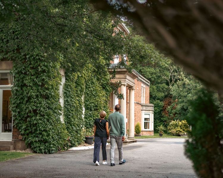 Couple walking outside farington lodge hotel