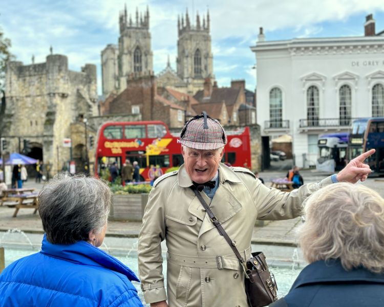 guide talking to group on a historical walking tour in york