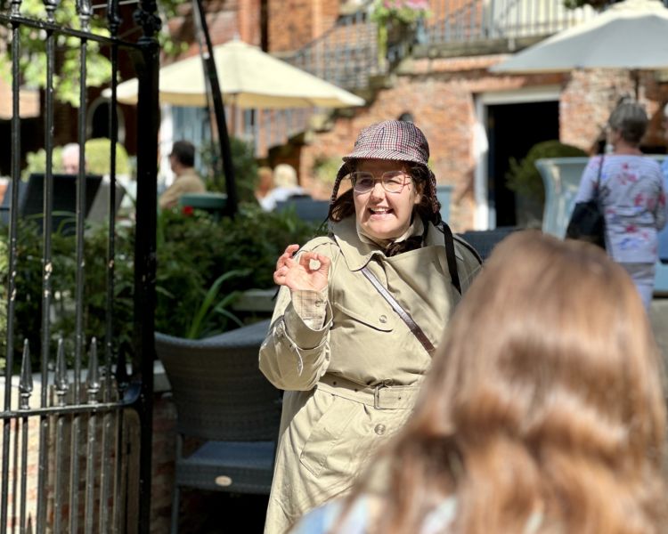 guide talking to group on a historical walking tour in york