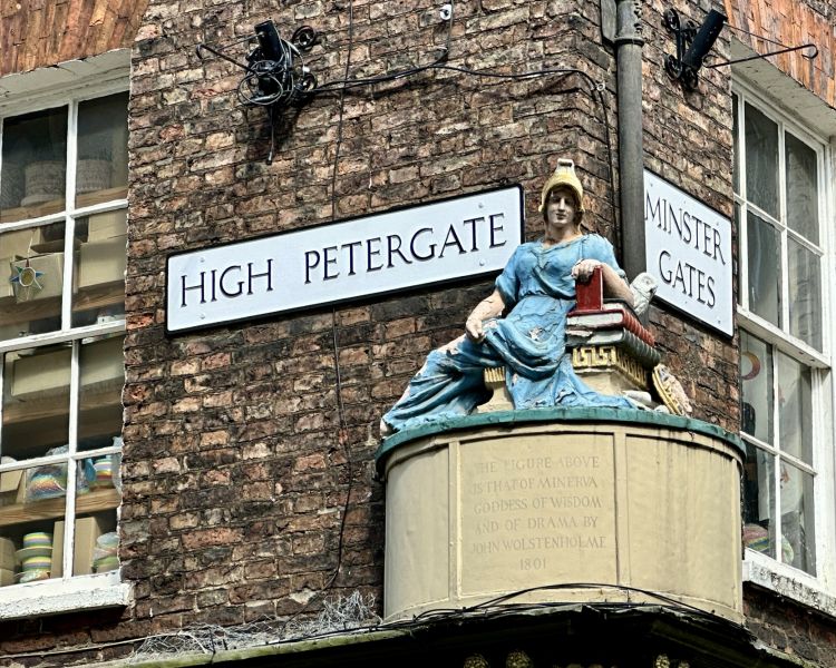 statue on wall on high petergate seen on a historical walking tour in york