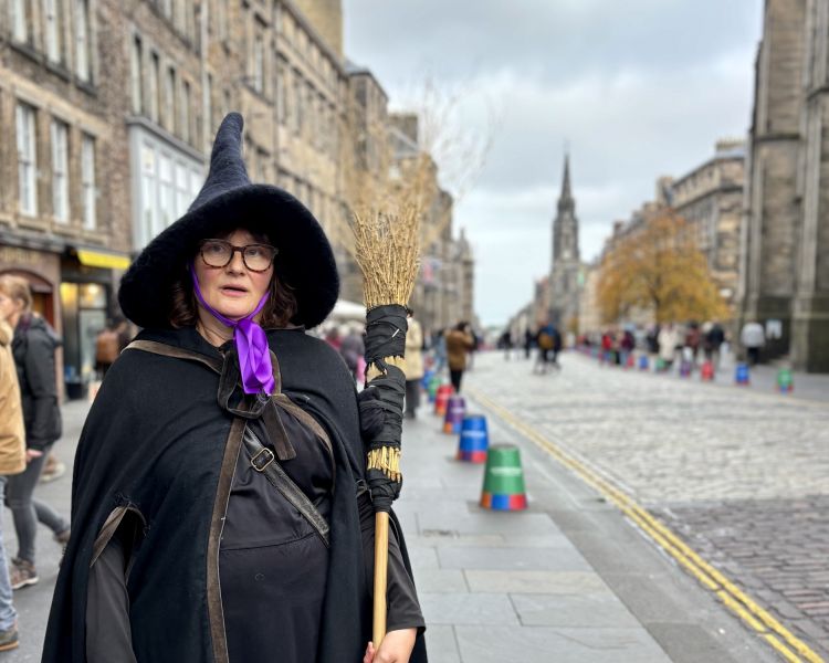 guide on edinburgh street on a witches walking tour in edinburgh