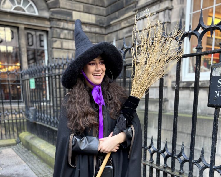 guide smiling on a witches walking tour in edinburgh
