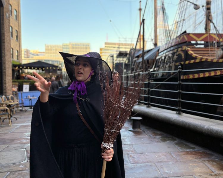 witches tour guide by the thames on a witches walking tour in london